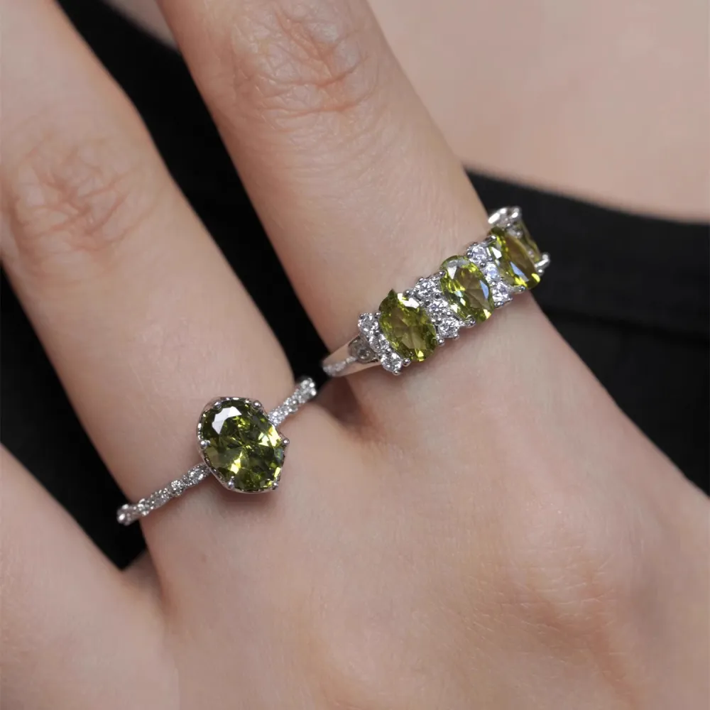 ✨ A little sparkle. A lot of elegance. The rich olive-green stones paired with a delicate silver-tone setting create a look that feels effortlessly luxurious.  Wear it alone for a refined touch or stack your favorites for extra sparkle. 💚