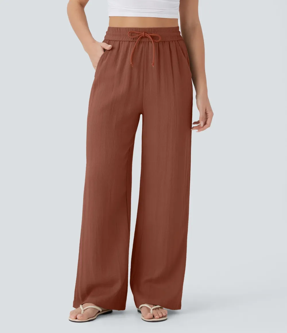2026🔥  Wide-leg, flowing, high-waisted trousers with drawstring, side pockets and a linen look