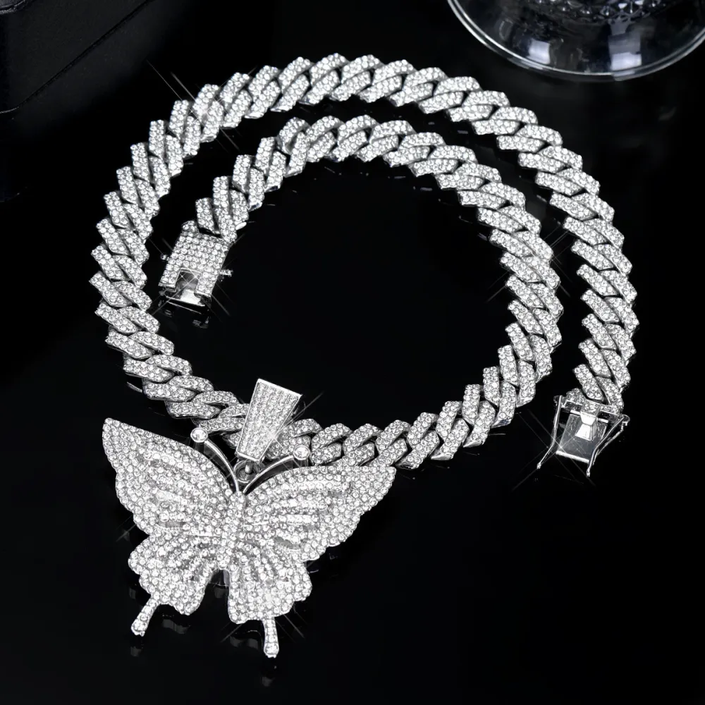 🦋 MAKE YOUR LOOK HIT DIFFERENT. ✨  Turn heads with an Iced-Out Butterfly Pendant that brings serious shine to every fit. Bold Cuban-link style. Statement butterfly design. Maximum sparkle from every angle. 💎
