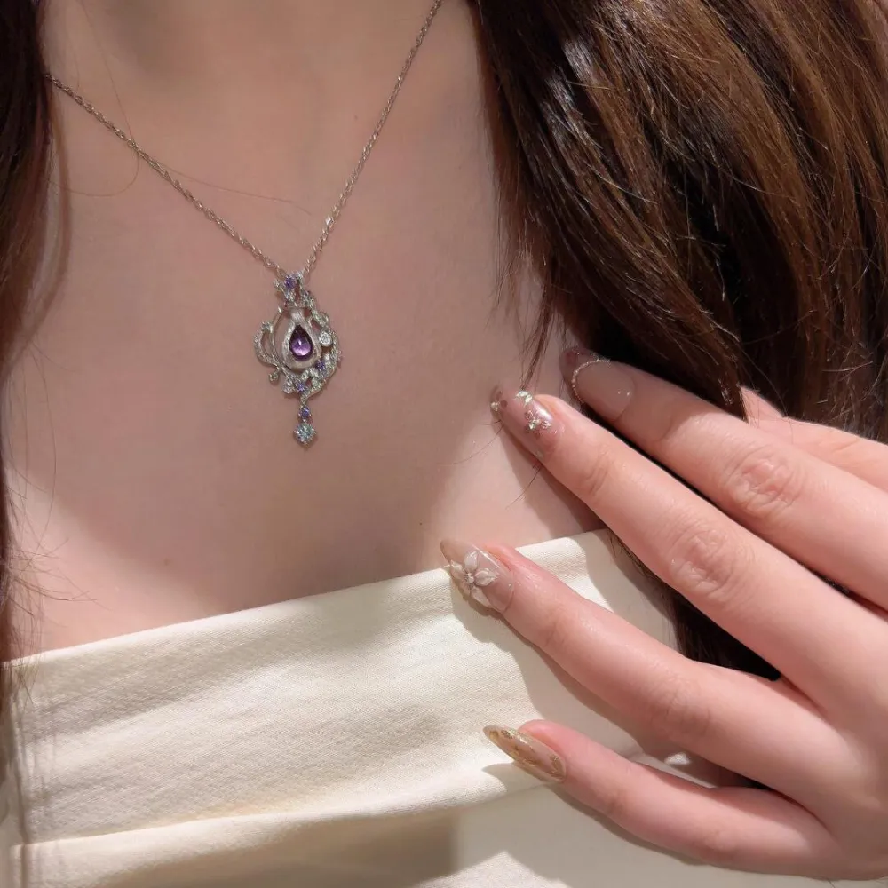 ✨ A little sparkle makes every moment feel special. Featuring a captivating purple teardrop stone surrounded by delicate shimmering details, this necklace adds an elegant touch to any look. 💜  Perfect for date nights, special occasions, or simply treatin