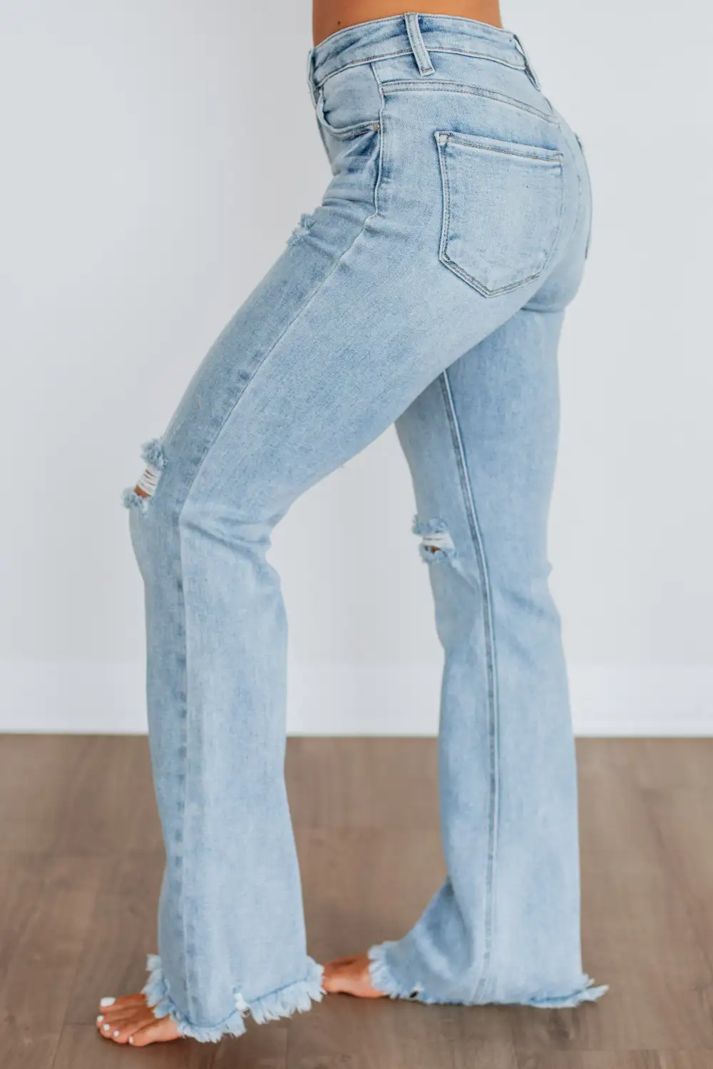 Women's High Rise Flared Leg Raw Hem Jeans