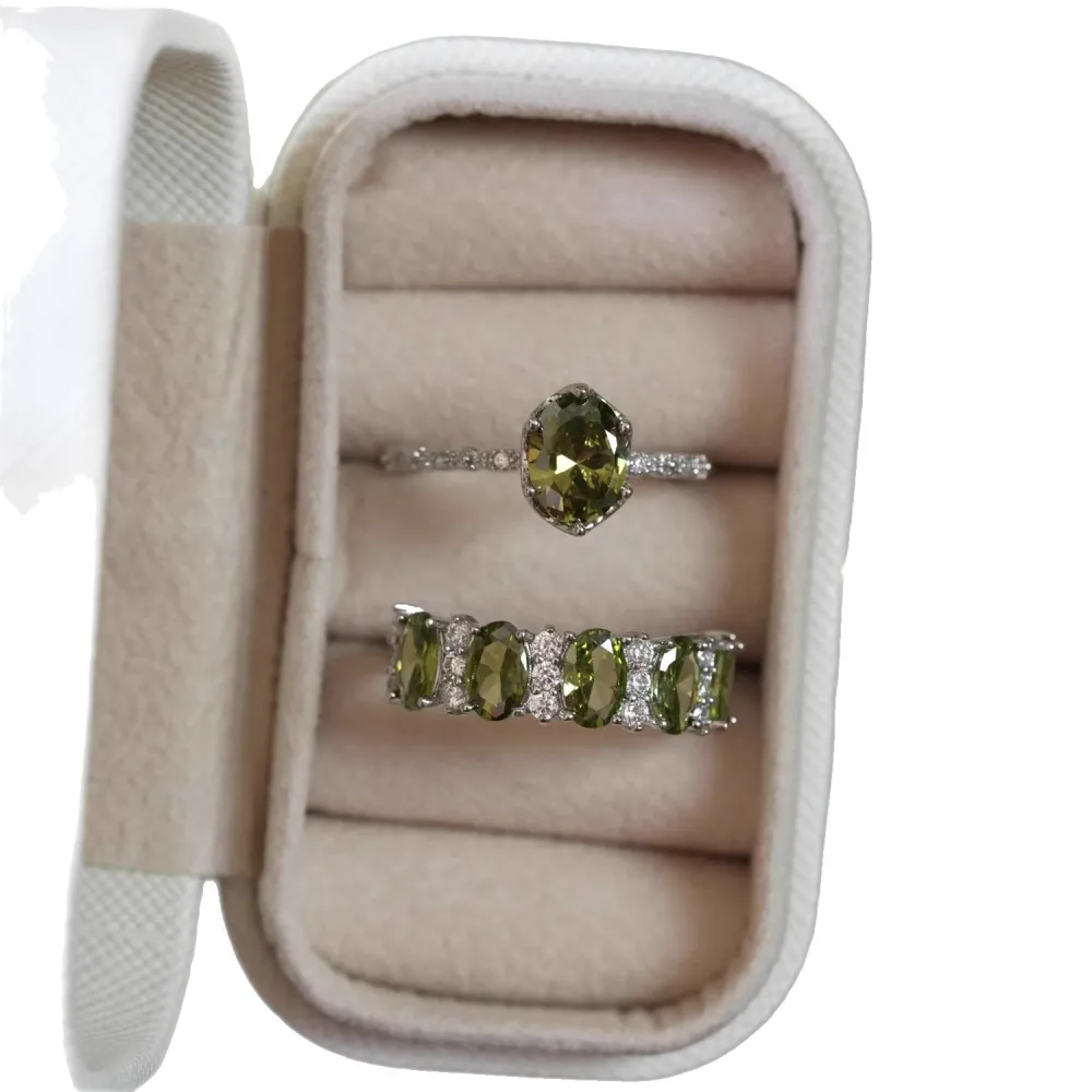 ✨ A little sparkle. A lot of elegance. The rich olive-green stones paired with a delicate silver-tone setting create a look that feels effortlessly luxurious.  Wear it alone for a refined touch or stack your favorites for extra sparkle. 💚