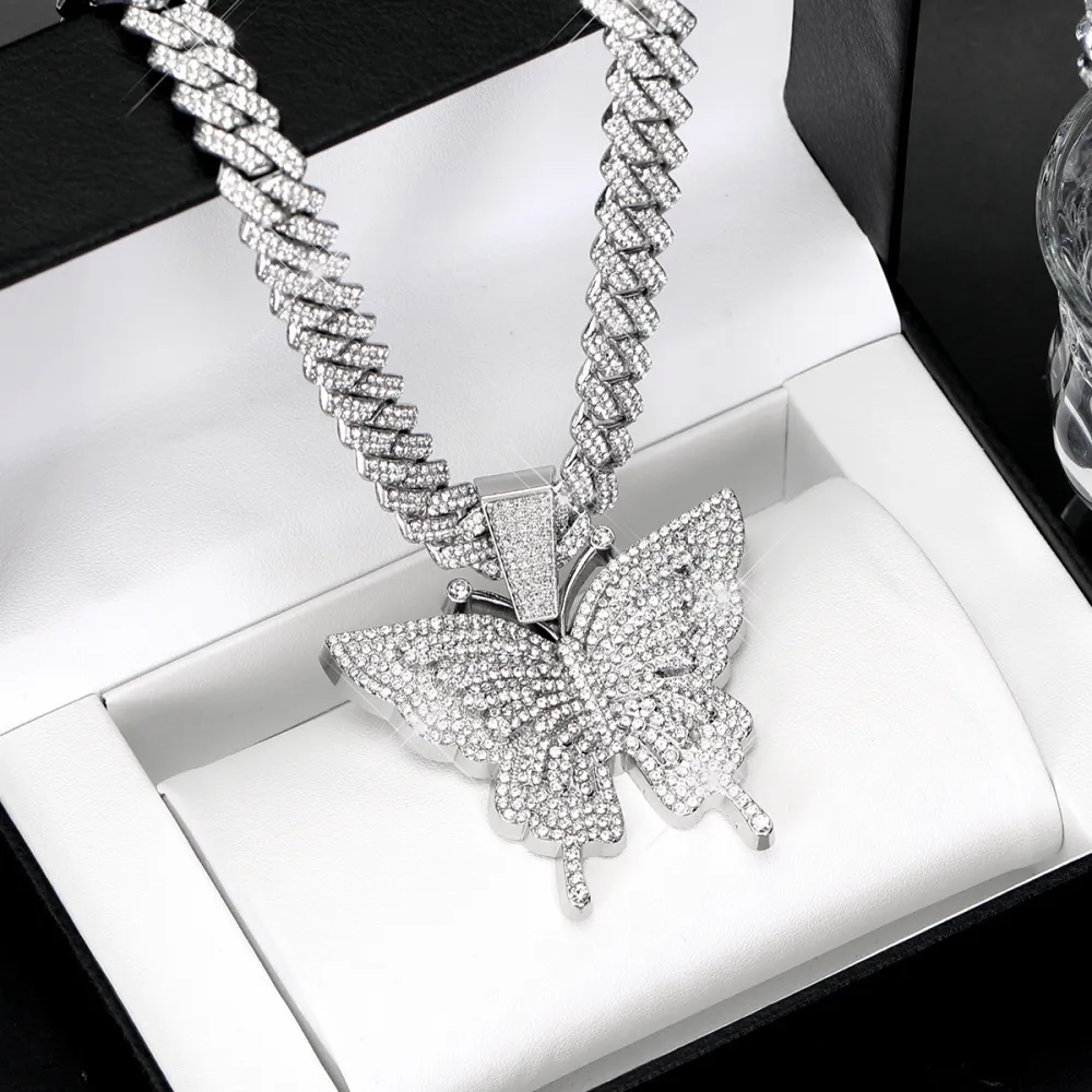 🦋 MAKE YOUR LOOK HIT DIFFERENT. ✨  Turn heads with an Iced-Out Butterfly Pendant that brings serious shine to every fit. Bold Cuban-link style. Statement butterfly design. Maximum sparkle from every angle. 💎