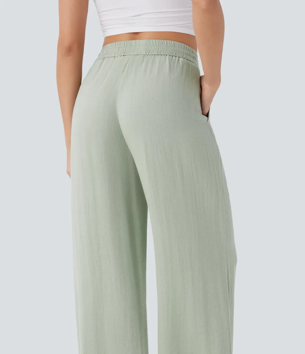 2026🔥  Wide-leg, flowing, high-waisted trousers with drawstring, side pockets and a linen look