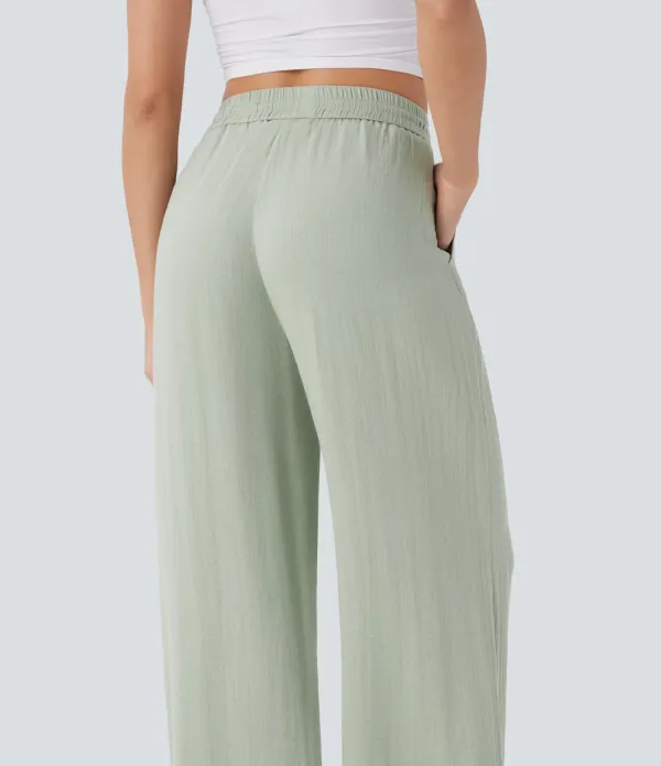 2026🔥  Wide-leg, flowing, high-waisted trousers with drawstring, side pockets and a linen look