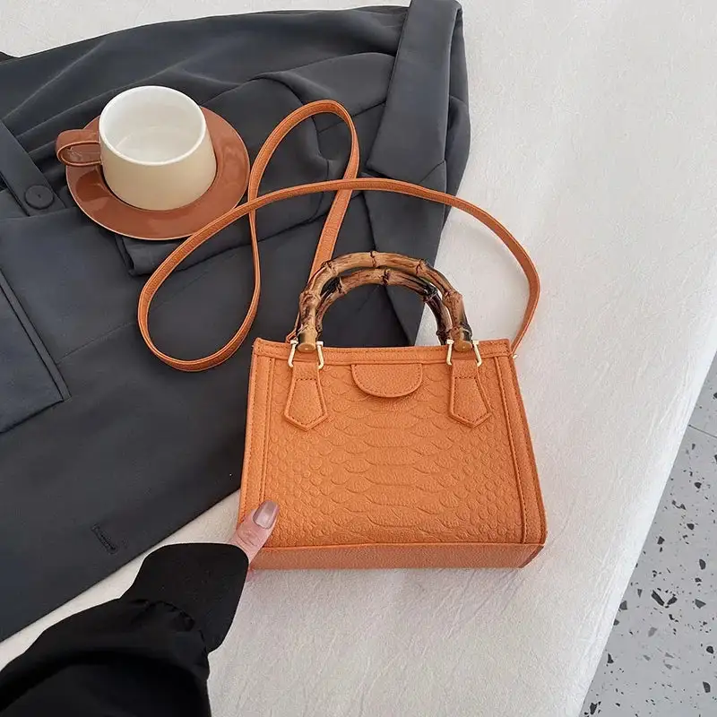 Artisanal Detail: Textured Bamboo-Handle Structured Bag