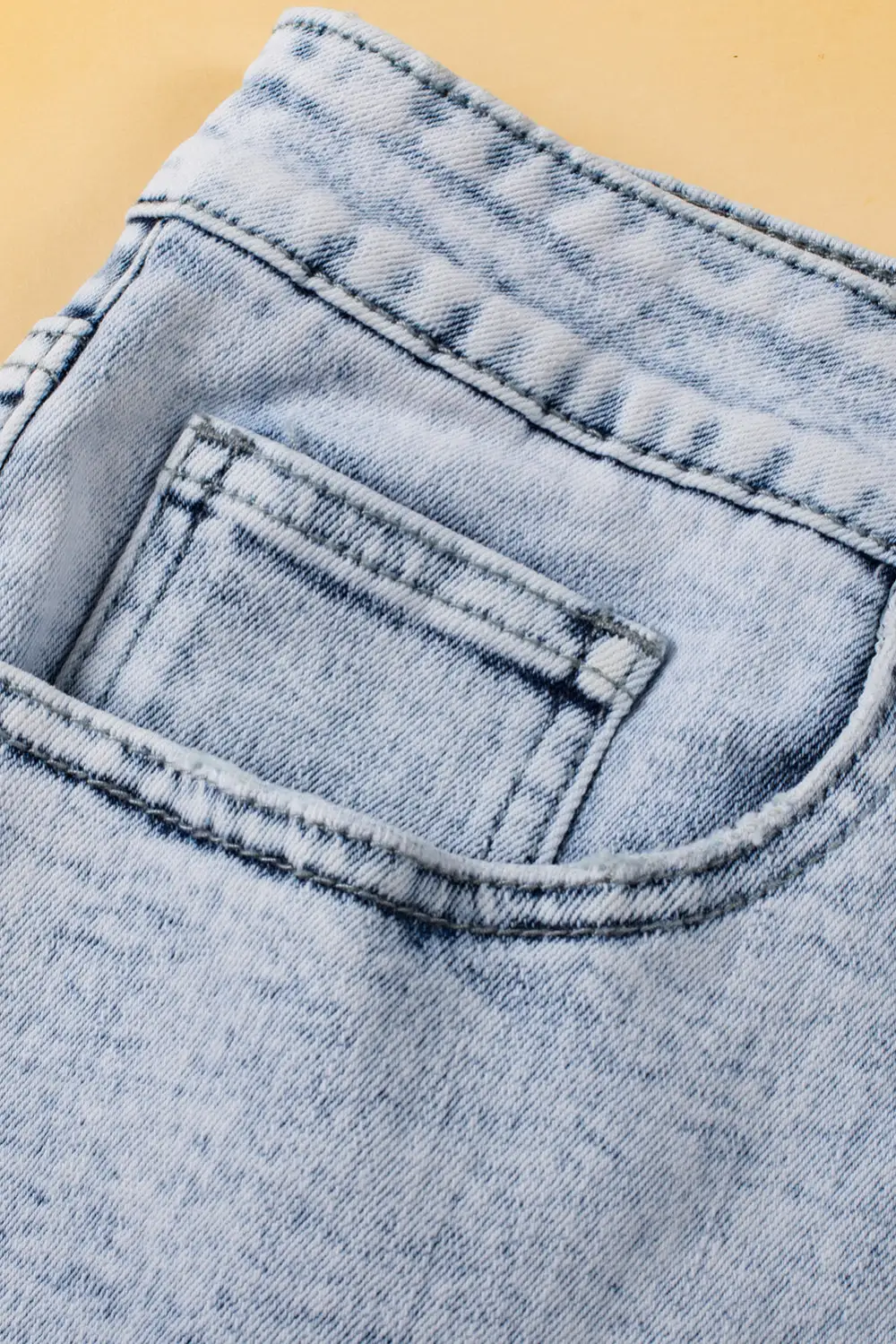 Light Blue Acid Wash Crossed Raw