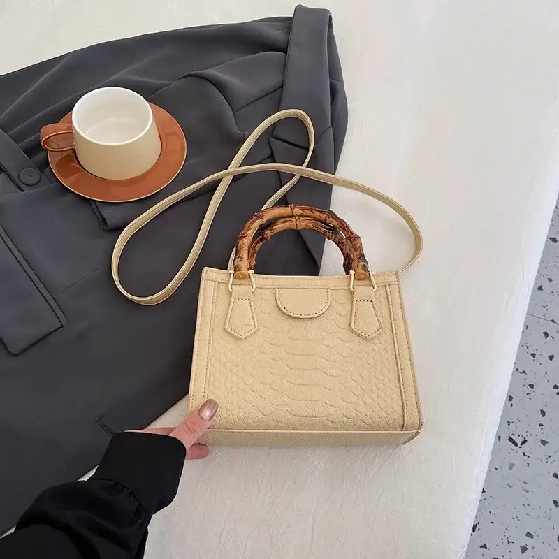 Artisanal Detail: Textured Bamboo-Handle Structured Bag