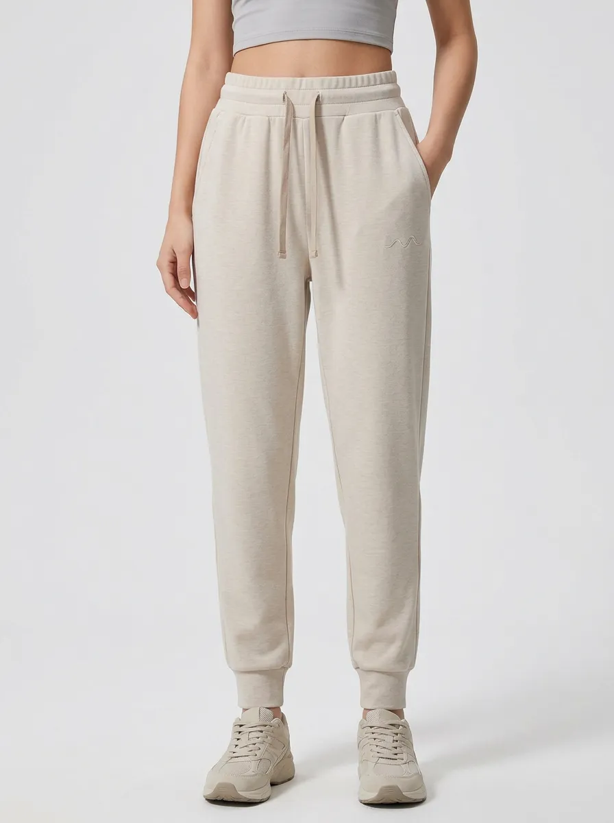Women's Minimalist Beige Solid Color Embroidered Jogger Pants