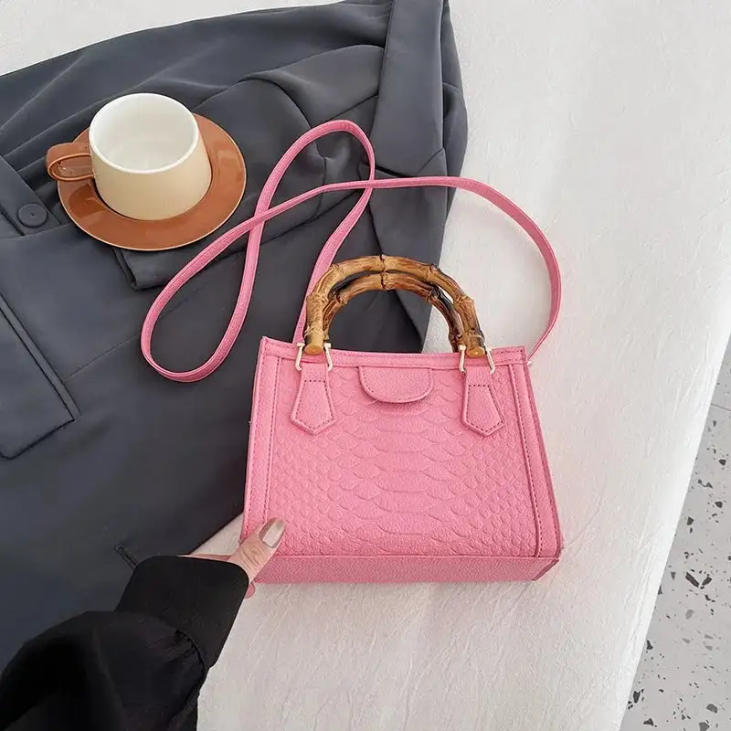 Artisanal Detail: Textured Bamboo-Handle Structured Bag