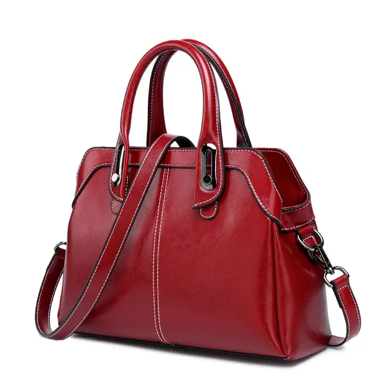 Structured Heritage: Genuine Leather Buckle-Handle Handbag