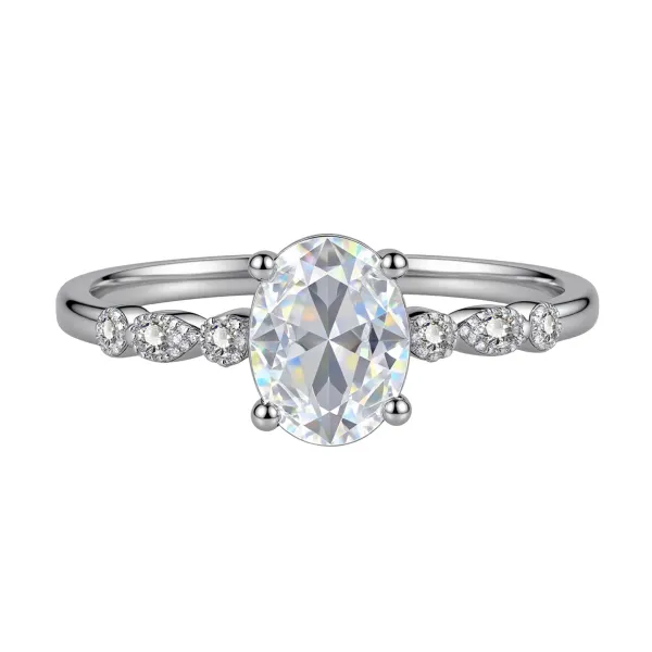 Elegant, delicate, and effortlessly beautiful. This oval gemstone ring features a brilliant faceted center stone surrounded by sparkling accents for a timeless, feminine look.