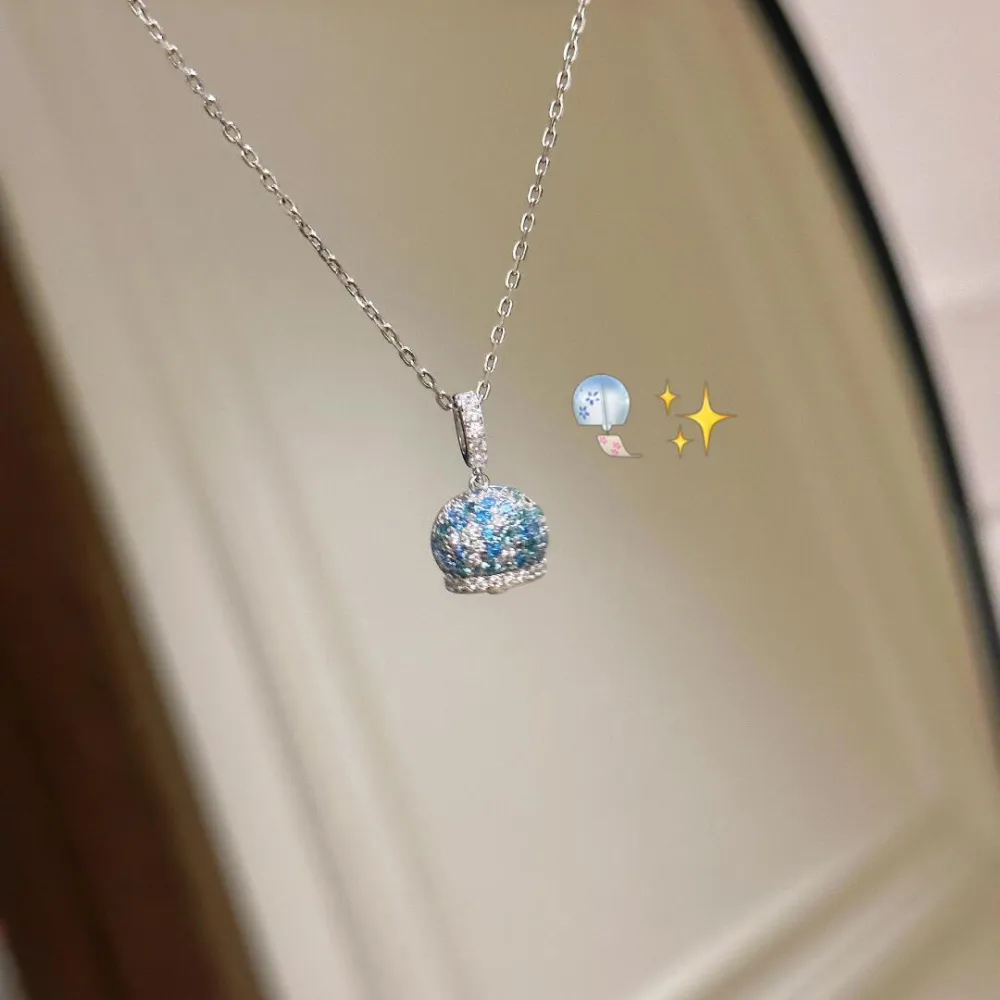 ✨ A little sparkle makes everything better. This dreamy crystal-inspired pendant catches the light beautifully with shimmering blue and silver details. Delicate, elegant, and easy to wear with almost anything. 💙  Perfect for everyday outfits, date nights