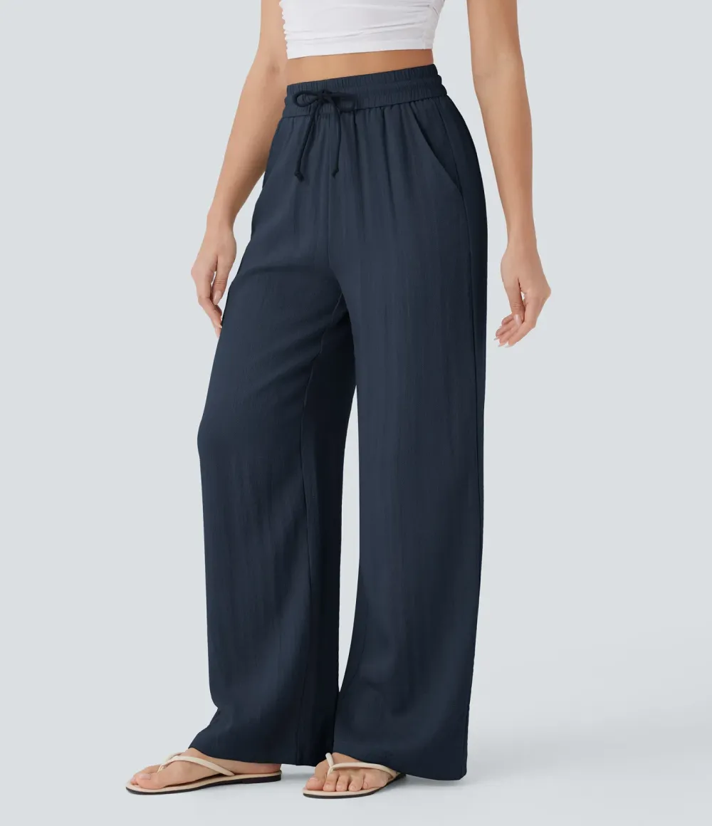 2026🔥  Wide-leg, flowing, high-waisted trousers with drawstring, side pockets and a linen look