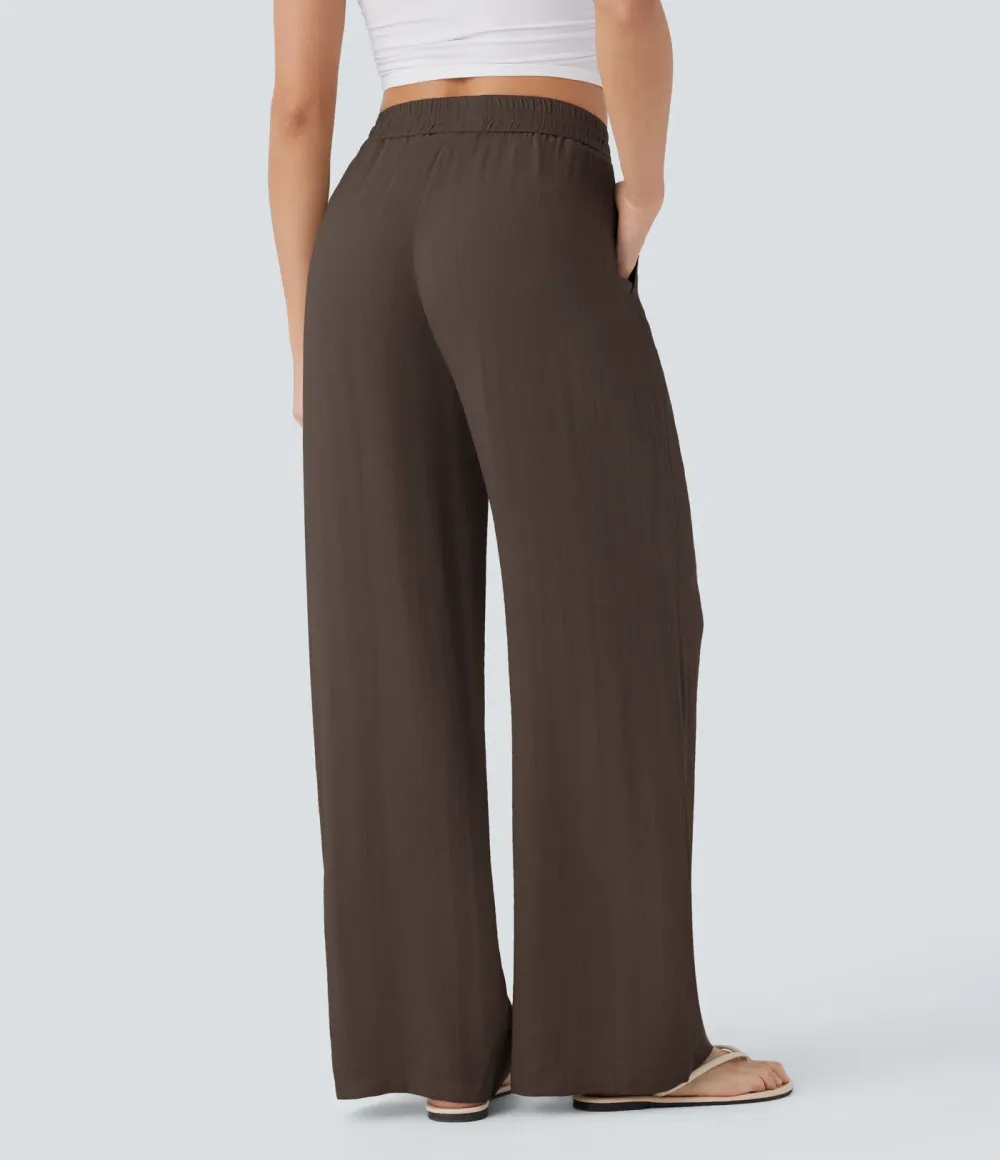 2026🔥  Wide-leg, flowing, high-waisted trousers with drawstring, side pockets and a linen look