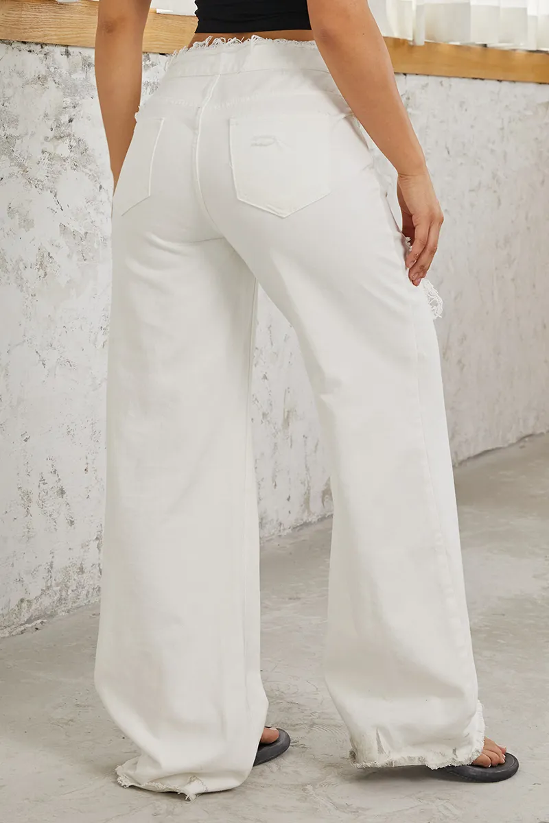 Mid Waist Ripped Raw Hem Flare Jeans
