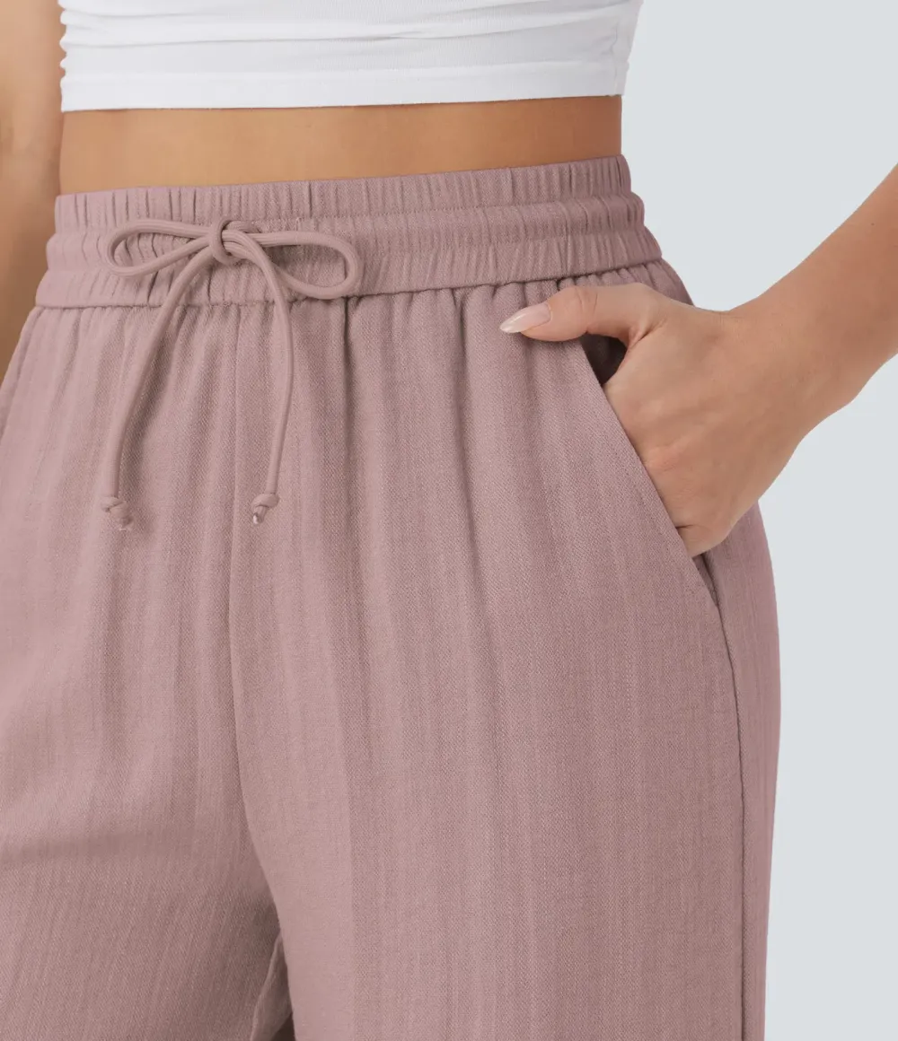 2026🔥  Wide-leg, flowing, high-waisted trousers with drawstring, side pockets and a linen look
