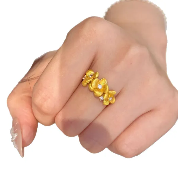 The Golden Blossom Ring turns delicate flowers into an eye-catching piece of jewelry.  Its textured petals catch the light beautifully, while sparkling crystal accents add just enough shine without feeling overdone.  Perfect with dresses, everyday outfits