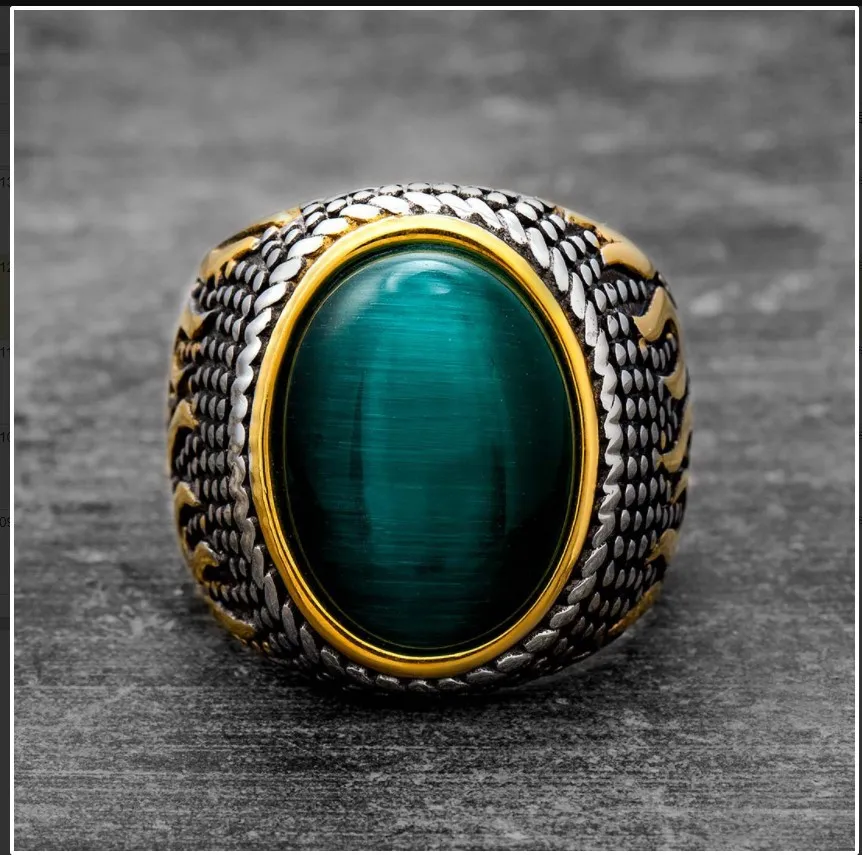 💚 A Ring That Commands Attention.  Deep green cat-eye style stone, intricate vintage detailing, and a striking silver & gold-tone finish — this statement ring brings timeless character to every look.  Perfect for men who prefer bold accessories with a cl