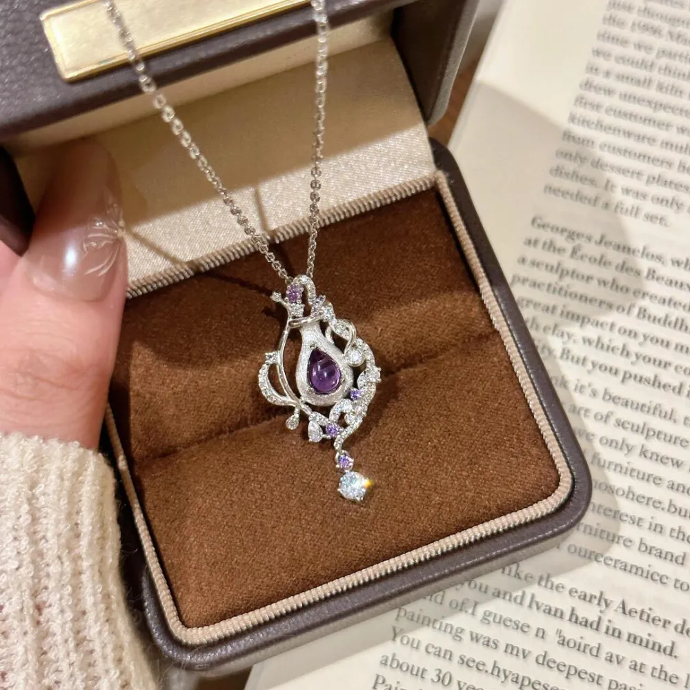 ✨ A little sparkle makes every moment feel special. Featuring a captivating purple teardrop stone surrounded by delicate shimmering details, this necklace adds an elegant touch to any look. 💜  Perfect for date nights, special occasions, or simply treatin