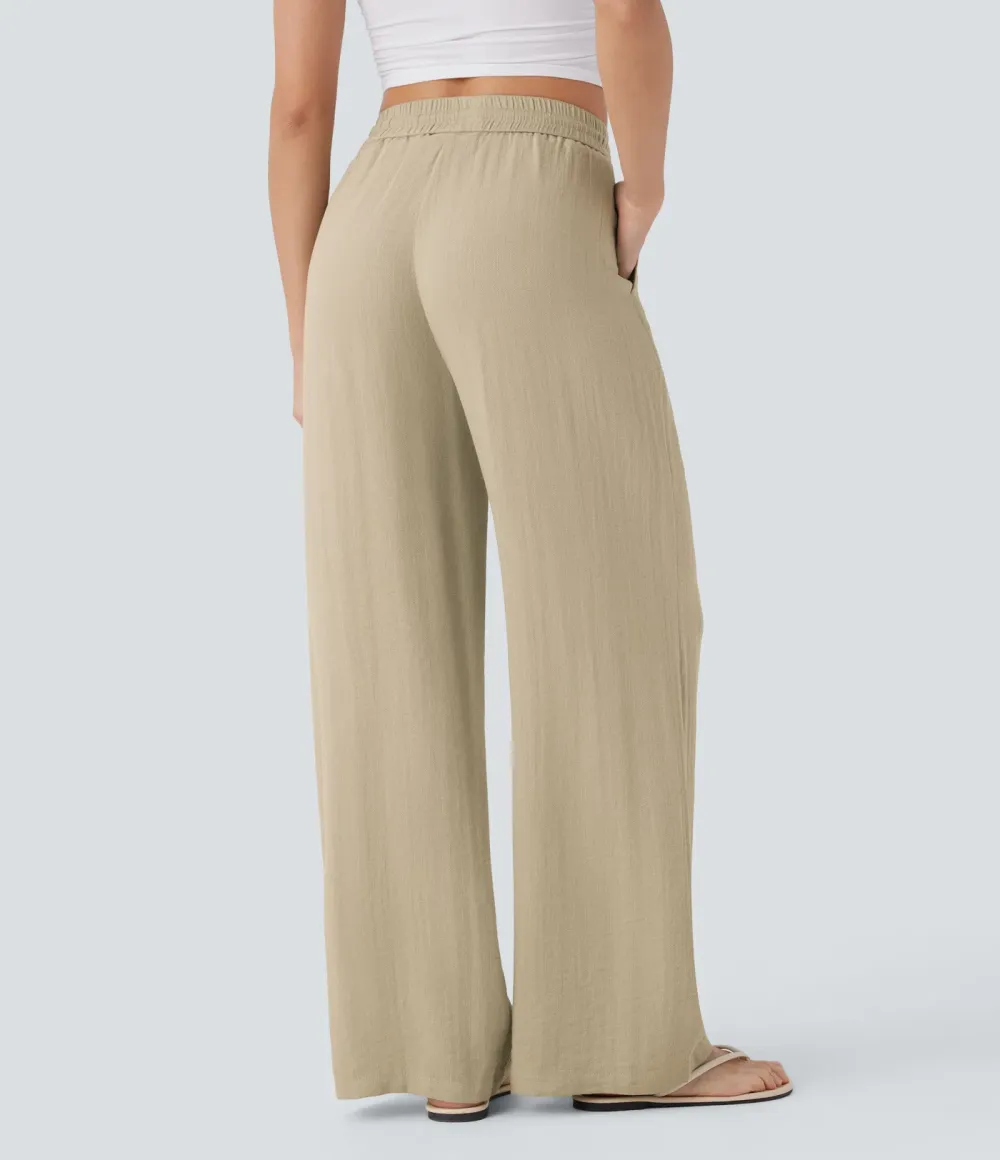 2026🔥  Wide-leg, flowing, high-waisted trousers with drawstring, side pockets and a linen look