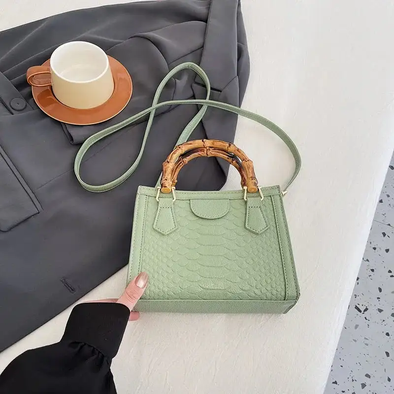 Artisanal Detail: Textured Bamboo-Handle Structured Bag
