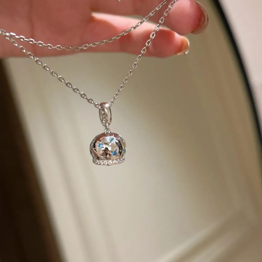 ✨ A little sparkle makes everything better. This dreamy crystal-inspired pendant catches the light beautifully with shimmering blue and silver details. Delicate, elegant, and easy to wear with almost anything. 💙  Perfect for everyday outfits, date nights