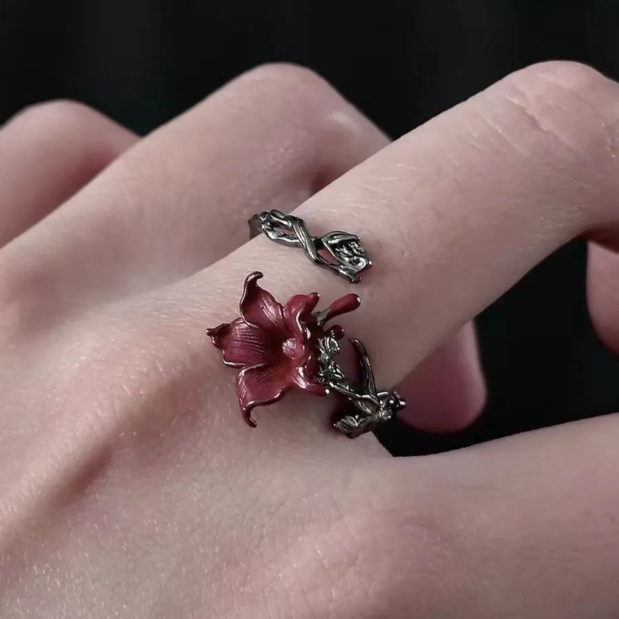 🌹 A Rose That Never Fades.  Dark, romantic, and beautifully unexpected. This vintage-inspired floral ring wraps around your finger like a tiny blooming vine, finished with a deep red flower that instantly catches the eye.
