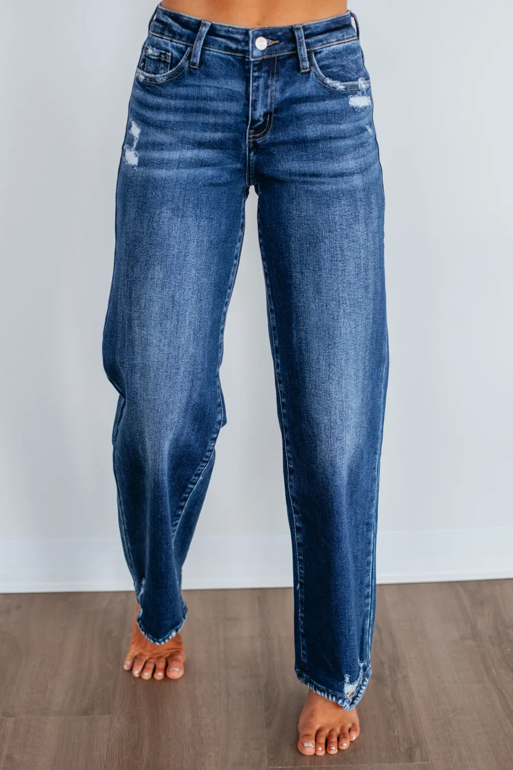 Women's High Rise Raw Hem Fading Whiskering Jeans
