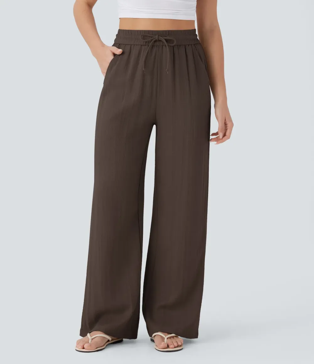 2026🔥  Wide-leg, flowing, high-waisted trousers with drawstring, side pockets and a linen look