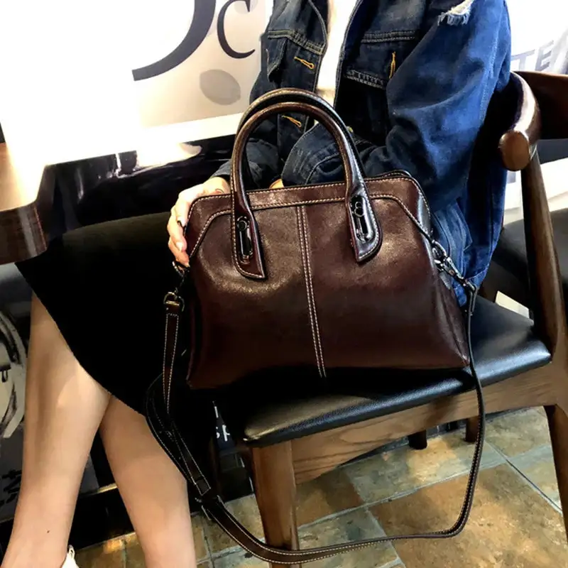 Structured Heritage: Genuine Leather Buckle-Handle Handbag