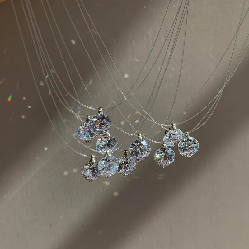 ✨ It looks like it’s floating on your skin. A barely-there clear necklace paired with a sparkling solitaire pendant creates the perfect minimalist look. Delicate, elegant, and effortless enough to wear every day. 💎  Wear it alone for a clean look or laye