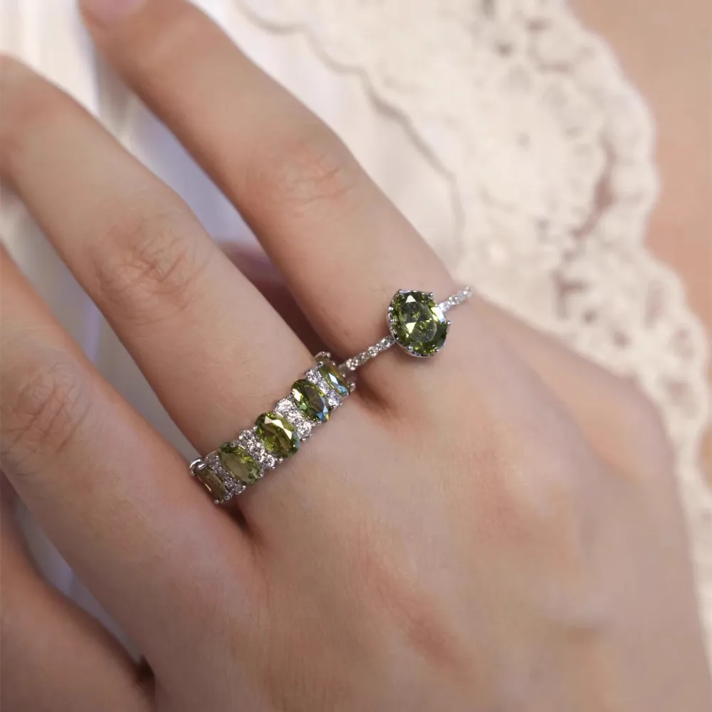 ✨ A little sparkle. A lot of elegance. The rich olive-green stones paired with a delicate silver-tone setting create a look that feels effortlessly luxurious.  Wear it alone for a refined touch or stack your favorites for extra sparkle. 💚