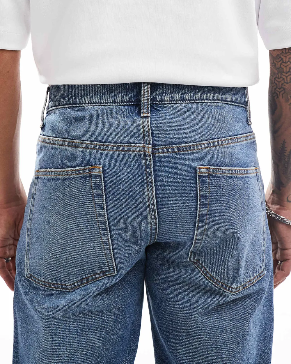 Tapered Jeans With Abrasions In Midwash Blue