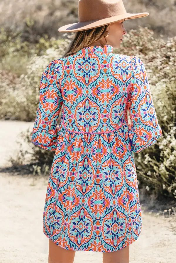 Abstract Long Sleeve Tied Neckline Mini Dress