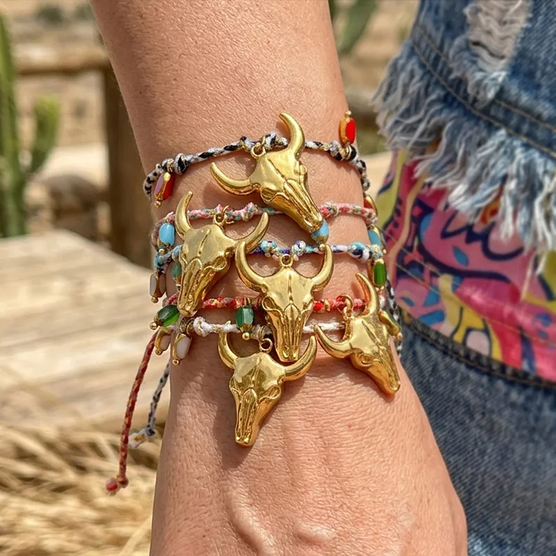 A little western. A little boho. A whole lot of personality.  Featuring a statement bull skull charm, colorful braided details and delicate bead accents, this bracelet instantly gives your everyday look a more adventurous edge.