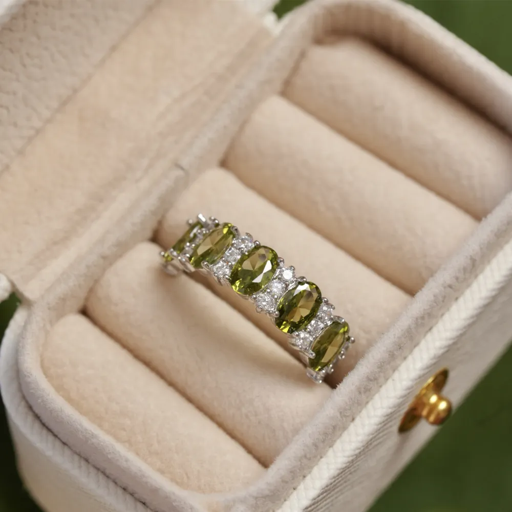 ✨ A little sparkle. A lot of elegance. The rich olive-green stones paired with a delicate silver-tone setting create a look that feels effortlessly luxurious.  Wear it alone for a refined touch or stack your favorites for extra sparkle. 💚