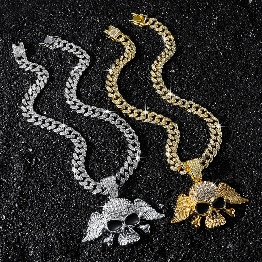 💀 NOT MADE TO BLEND IN. 🔥  Turn heads the second you walk in.  This iced-out Cuban chain features a bold winged skull pendant, packed with eye-catching shine and serious street attitude. Whether you choose Gold or Silver, this piece instantly upgrades y