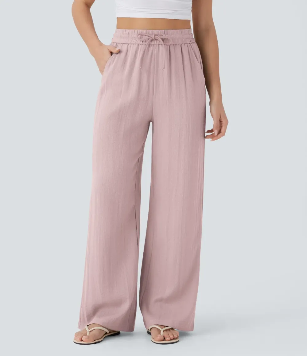 2026🔥  Wide-leg, flowing, high-waisted trousers with drawstring, side pockets and a linen look