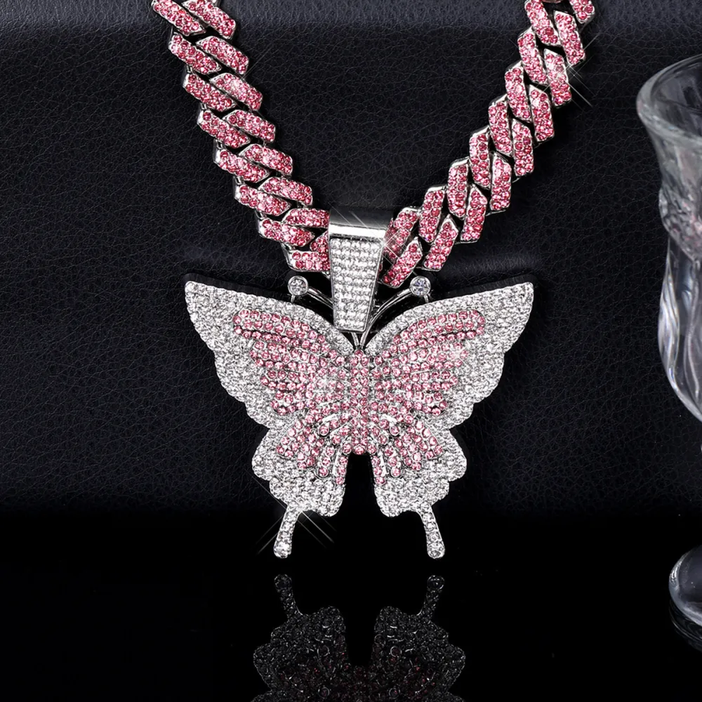 🦋 MAKE YOUR LOOK HIT DIFFERENT. ✨  Turn heads with an Iced-Out Butterfly Pendant that brings serious shine to every fit. Bold Cuban-link style. Statement butterfly design. Maximum sparkle from every angle. 💎