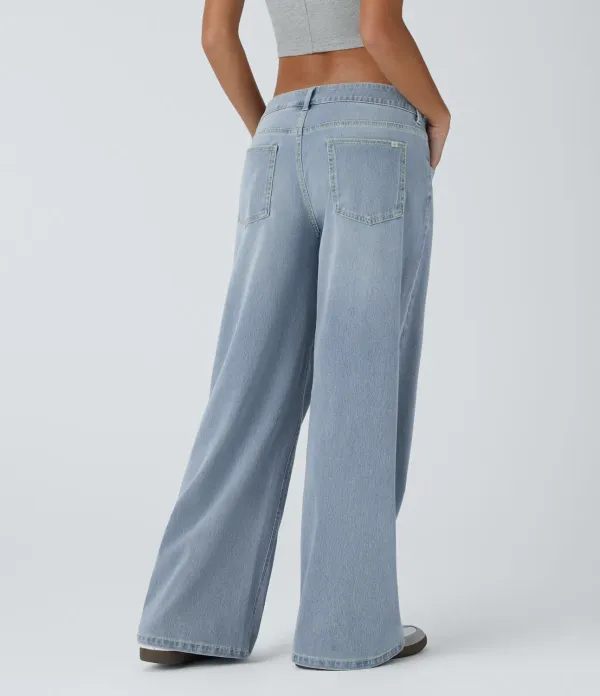 2026🔥  Low-rise wide-leg asymmetric jeans with button, zip, and multiple pockets; stretch knit fabric with a washed finish.
