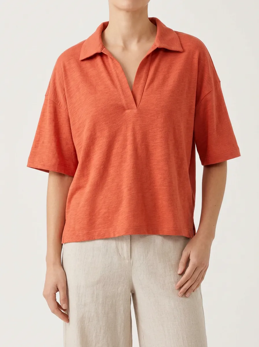 Women's Rust Orange V Neck Polo in a Solid Tone