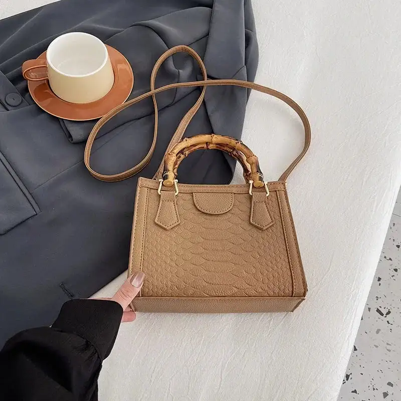 Artisanal Detail: Textured Bamboo-Handle Structured Bag