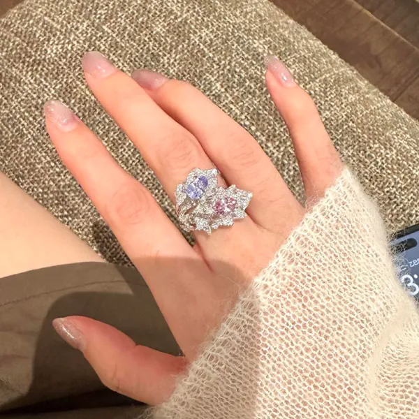✨ The kind of ring people can’t stop staring at. A dreamy mix of pink & lavender sparkle wrapped in an elegant leaf-inspired design. 💗💜