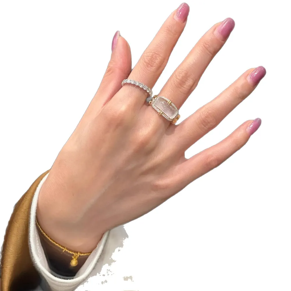 ✨ A ring that instantly elevates your look. Featuring a luminous translucent center stone, gold-tone detailing, and sparkling accents, this statement ring brings effortless elegance to every outfit.