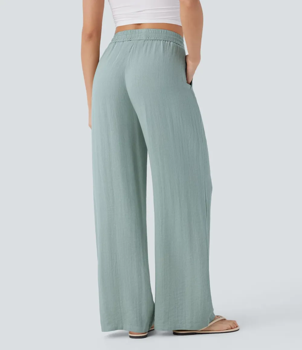 2026🔥  Wide-leg, flowing, high-waisted trousers with drawstring, side pockets and a linen look