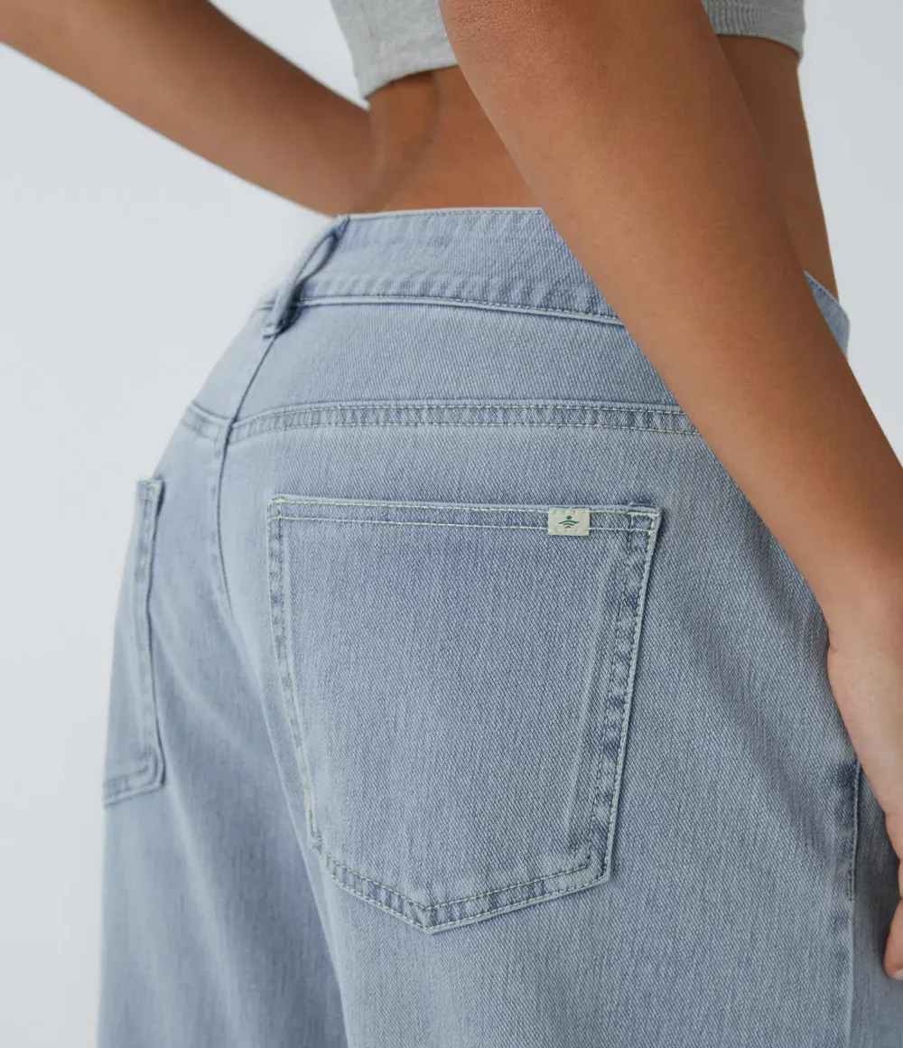2026🔥  Low-rise wide-leg asymmetric jeans with button, zip, and multiple pockets; stretch knit fabric with a washed finish.