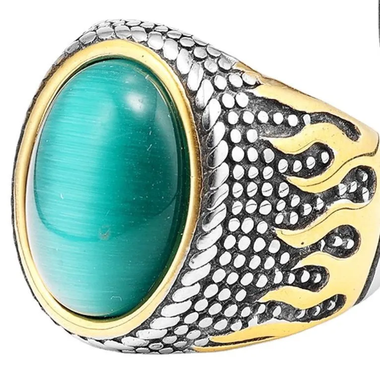 💚 A Ring That Commands Attention.  Deep green cat-eye style stone, intricate vintage detailing, and a striking silver & gold-tone finish — this statement ring brings timeless character to every look.  Perfect for men who prefer bold accessories with a cl