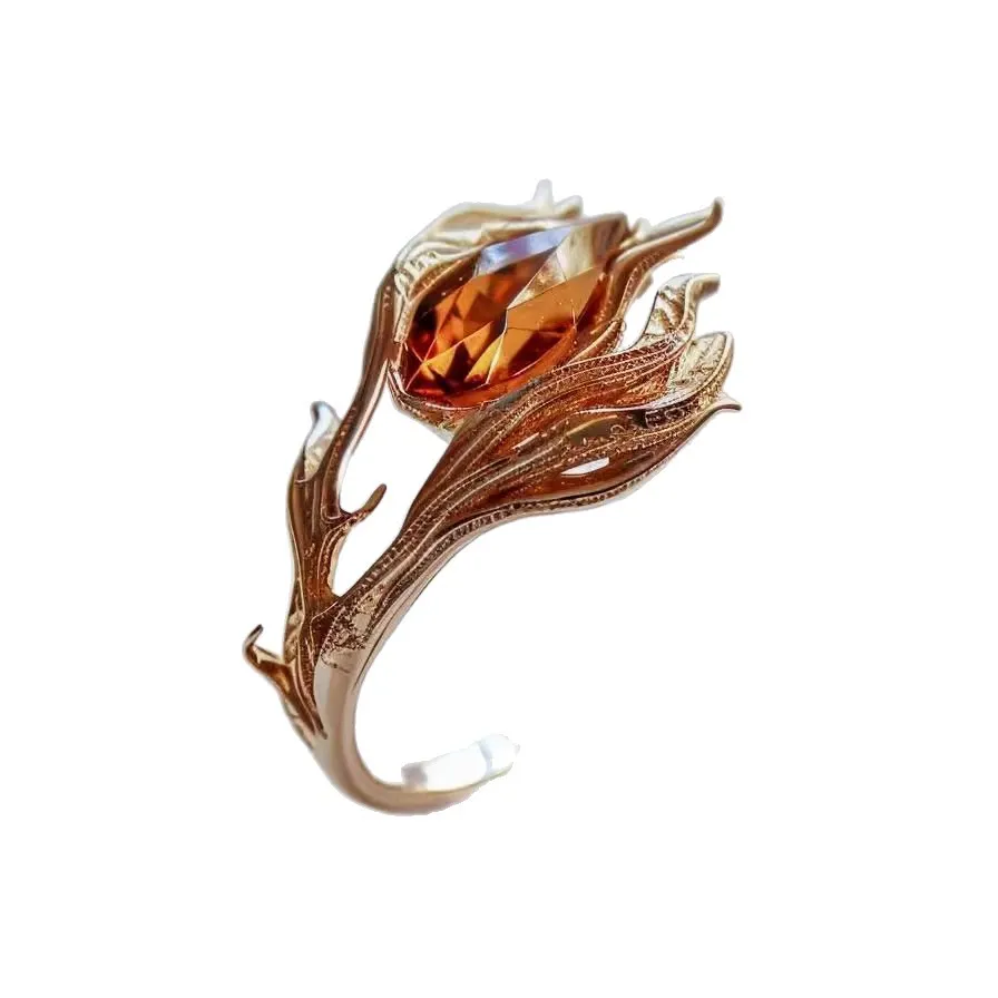 🔥 Wear the fire. Own the moment.  A striking ring inspired by flames and fantasy, featuring an intricate sculptural design wrapped around a brilliant amber-toned stone. ✨  Made for women who love jewelry that feels bold, elegant, and anything but ordinar