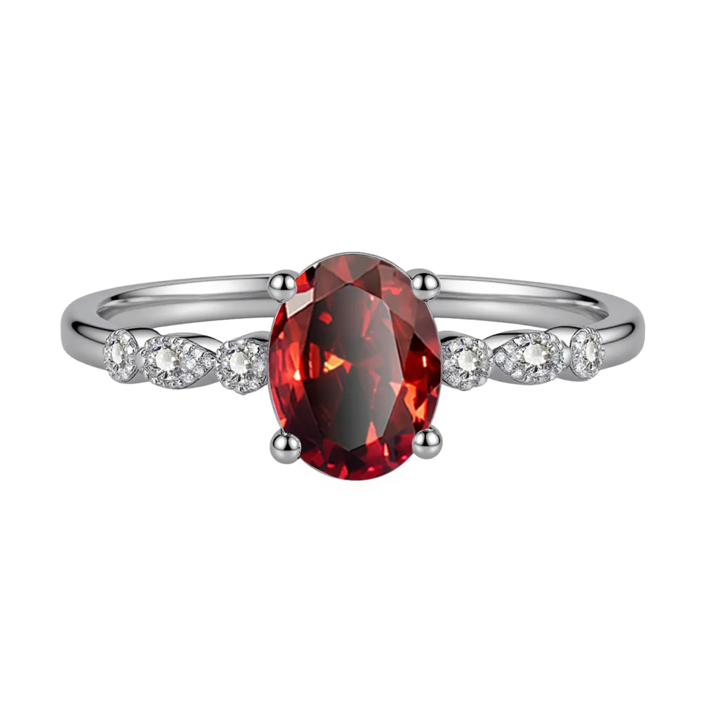 Elegant, delicate, and effortlessly beautiful. This oval gemstone ring features a brilliant faceted center stone surrounded by sparkling accents for a timeless, feminine look.